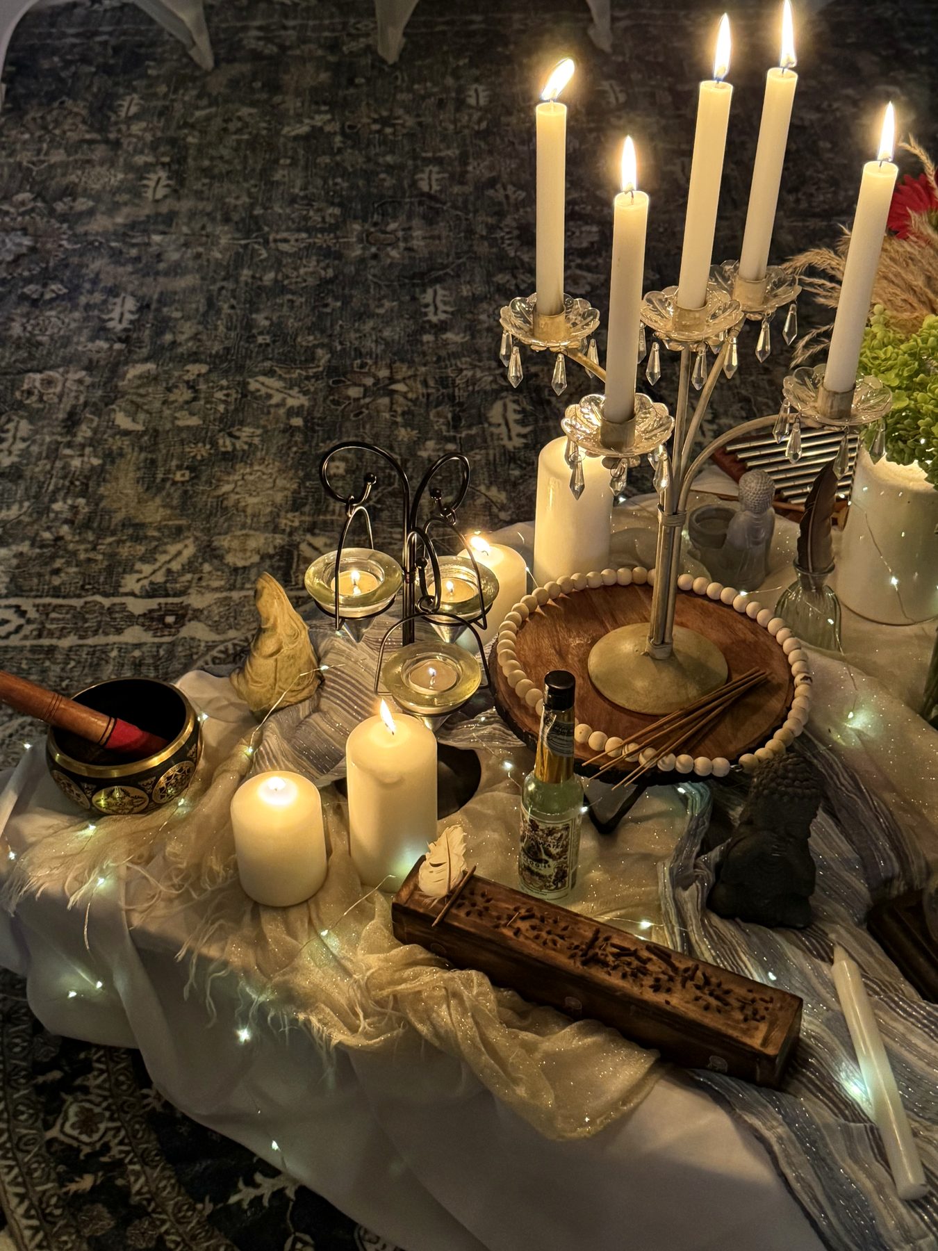Candlelight and altar details from the room where filming began