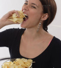 woman eats chips