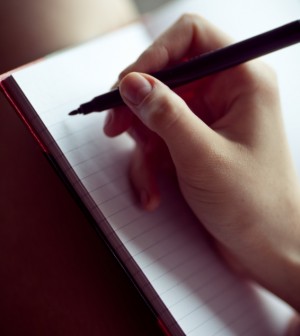 woman writing in journal